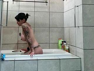 Tattooed stepsister gets a sneaky bath on hidden camera