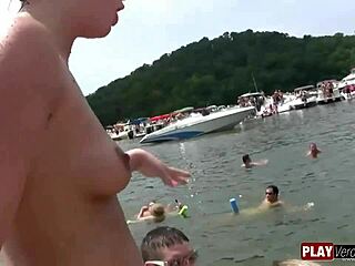 Big breasted amateur gets naked on the water