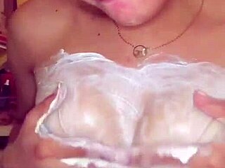 18-year-old amateur babe gets her boobs massaged with body milk