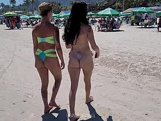 ブラジルの美女がビーチで2人の男性と戦う