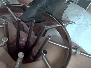 Femdom mistress dominates with massive anal speculum and strap-on in extreme video