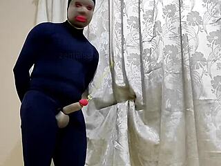 Human penis in zentai bondage with femdom